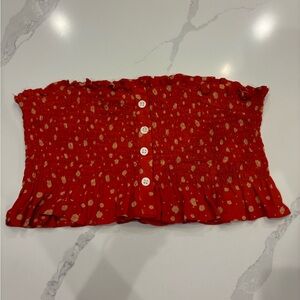 Red floral tube top, with buttons and ruffles.